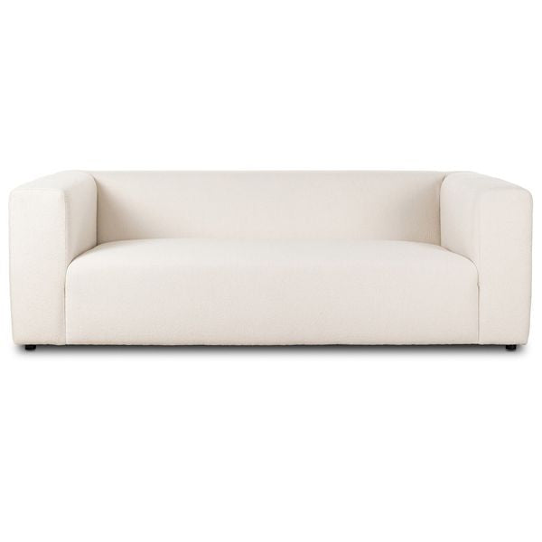 Sofa tapicerowana o lekkiej bryle z subtelnym wyrazem w odcieniu bieli