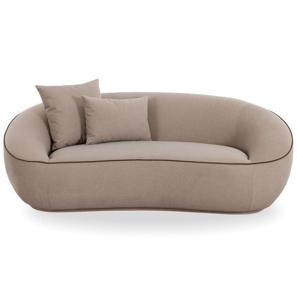 Sofa tapicerowana o nowoczesnym konturze z oszczednym detalem w odcieniu bezu