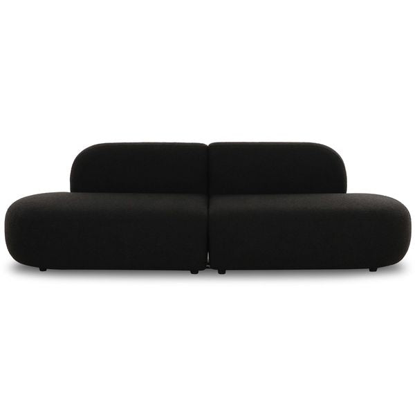 Sofa tapicerowana o spokojnej linii z dopracowana sylwetka w odcieniu czerni